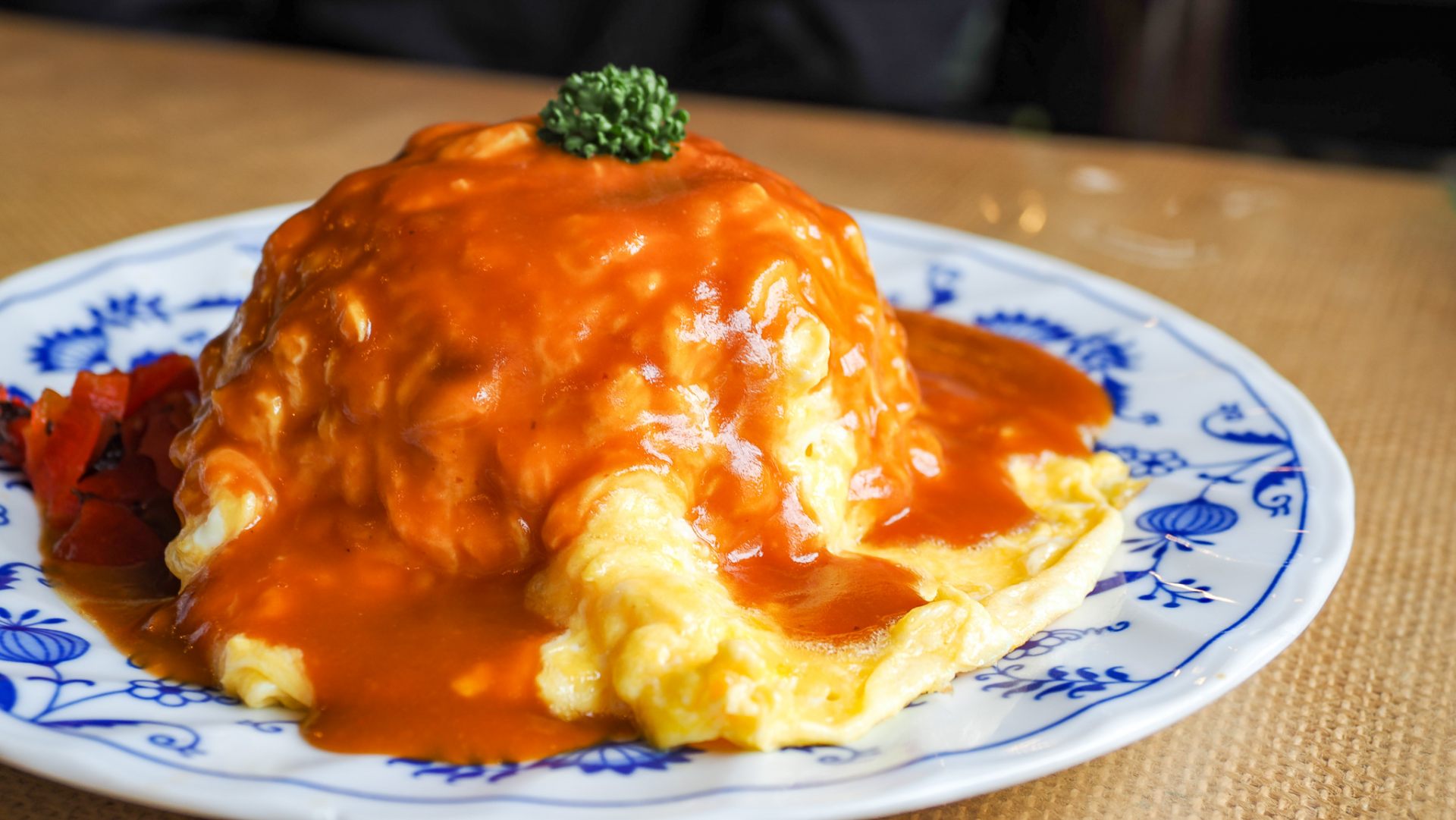 Omu rice that is an omelet with a filling of ketchup-seasoned fried rice