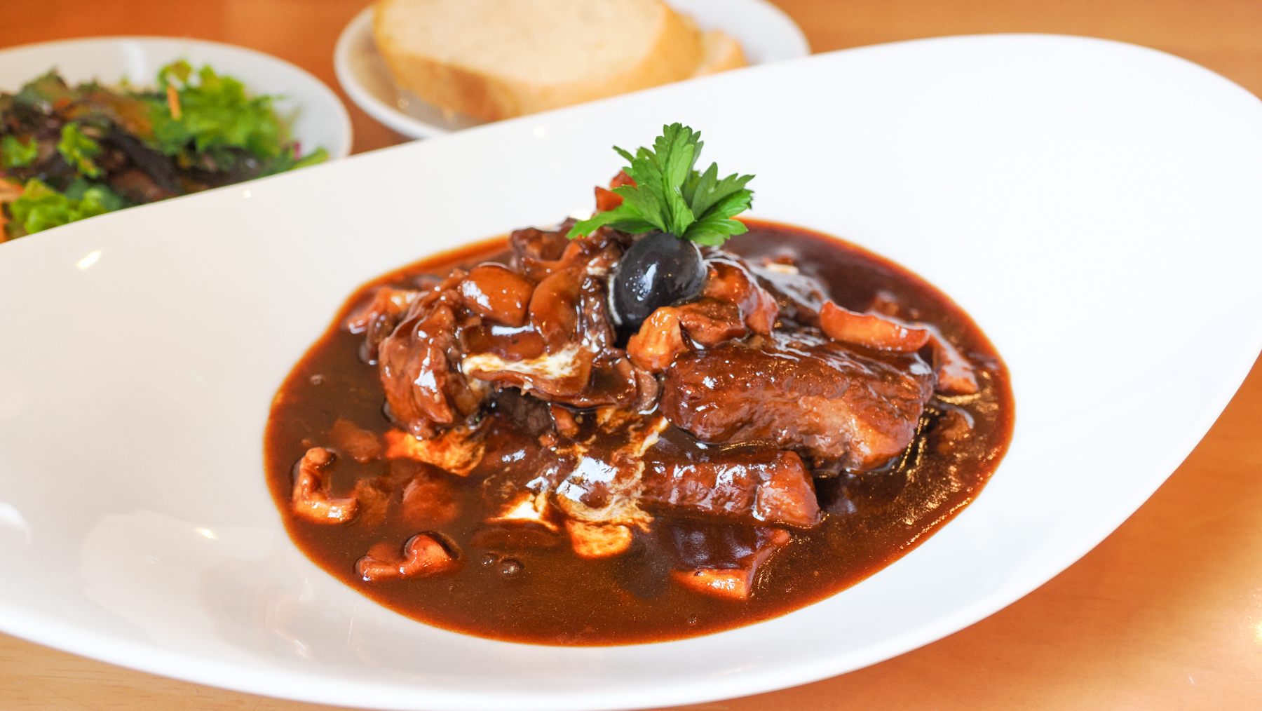 Beef stew with salad and bread as a set meal for lunch