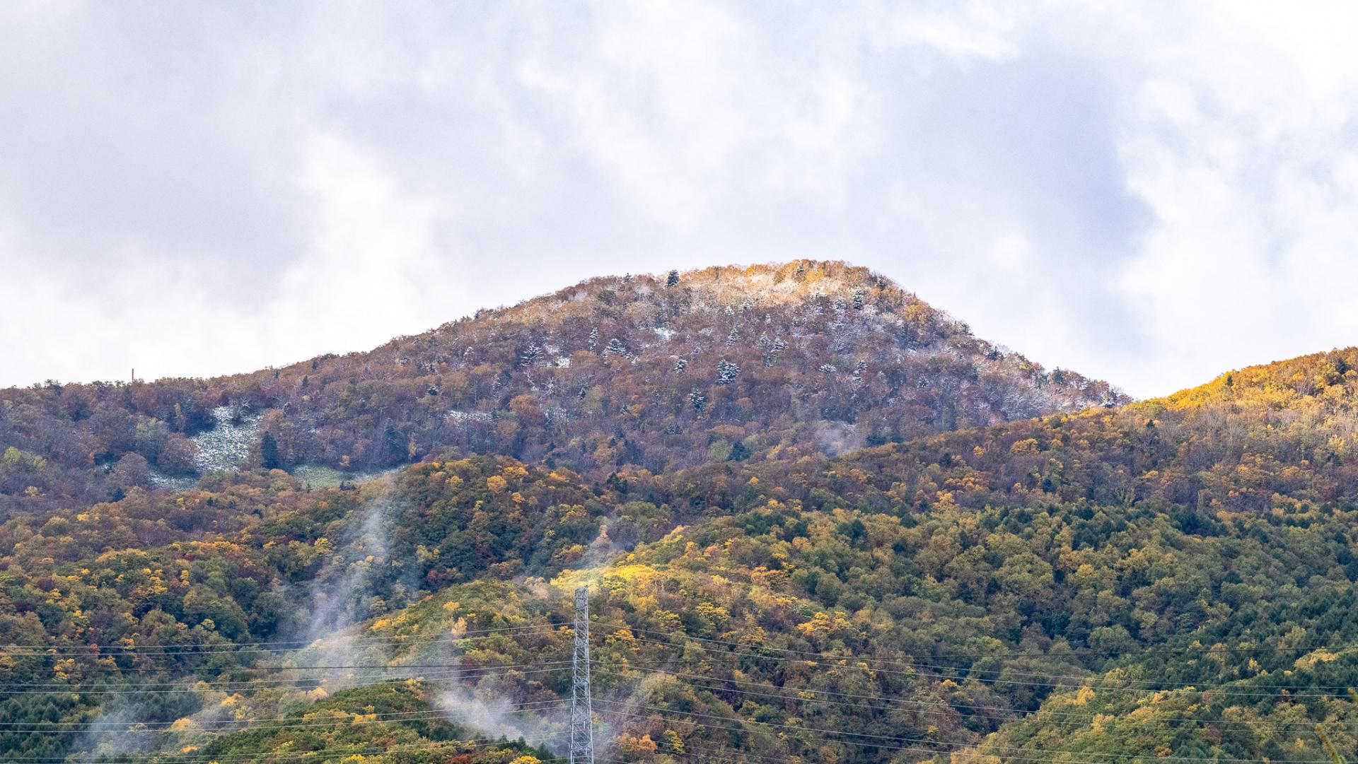 First snow fall on mountains in Sapporo on 17th October