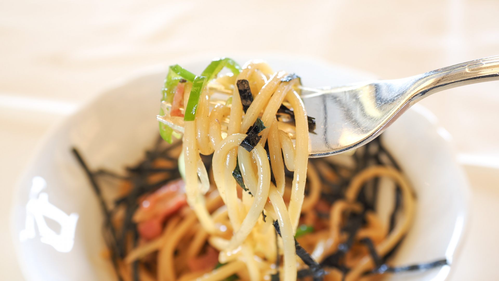 Pasta in the Japanese style topped with seaweed and pepper