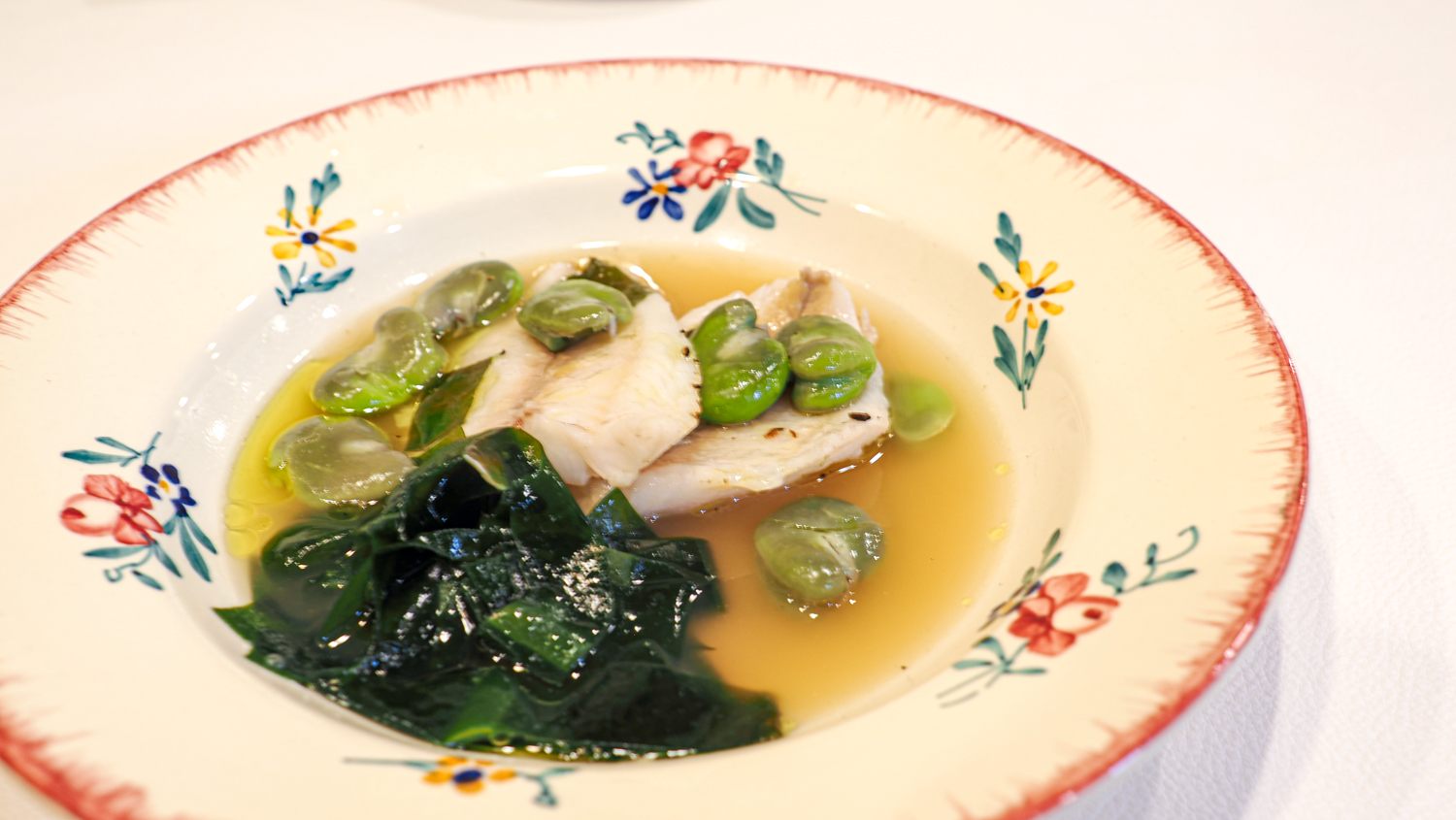 Soup style of Japanese butterfish with fave beans and wakame seaweed