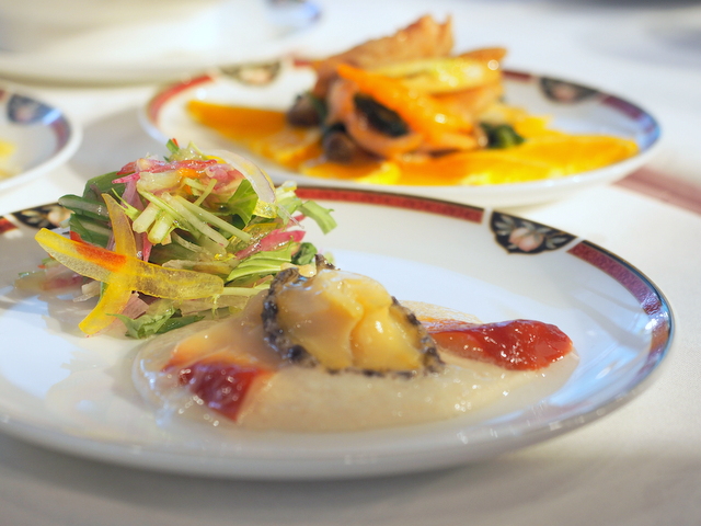 Abalone and surf clam with white sesame sauce, salad with sacha inchi oil