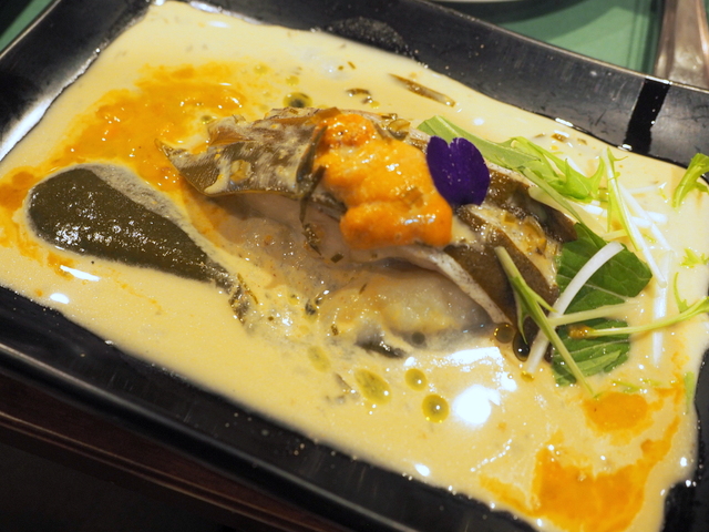 Steemed codfish and kelp from Rausu with sauce of sea arch,kelp soup and white wine