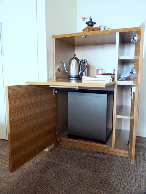 Refrigerator with chilled wine glasses and a safety box